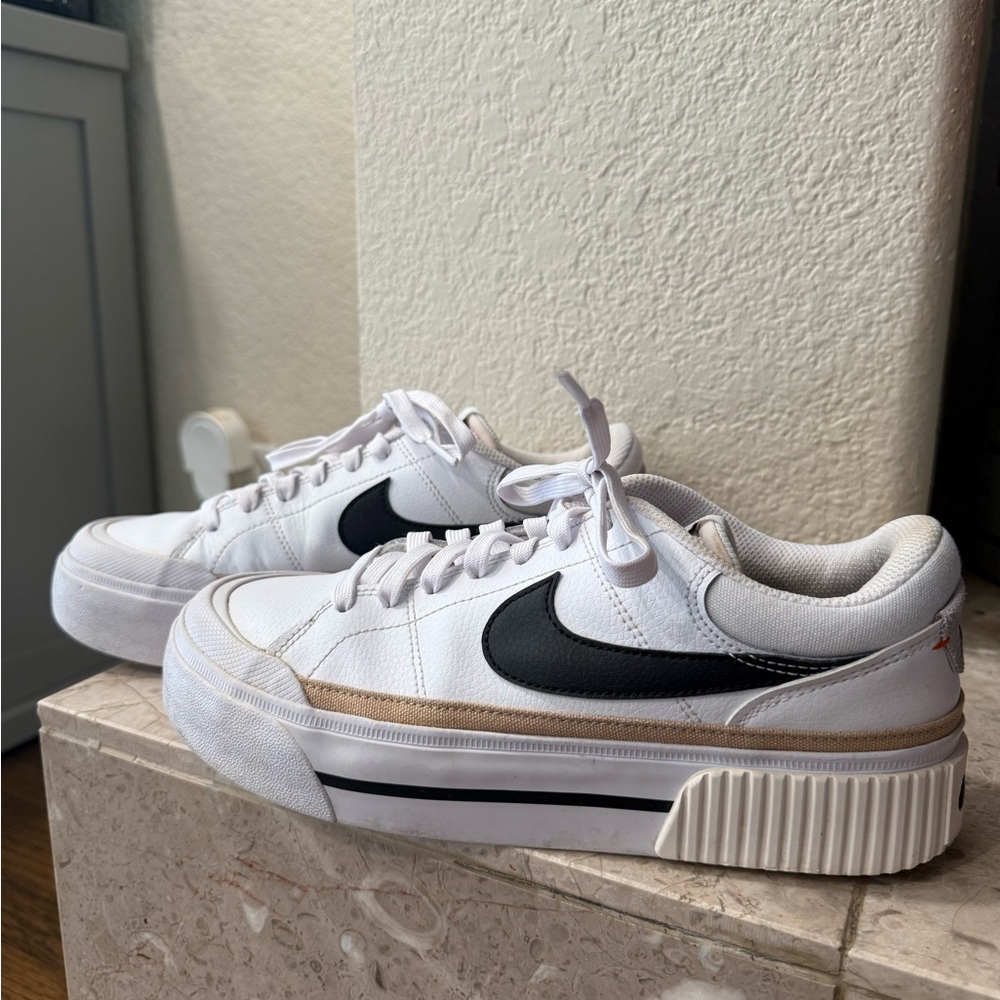 Nike White Sneakers with Black Logo